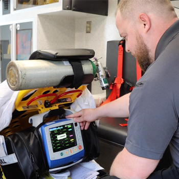 Timothy Tetterton working inside an ambulance